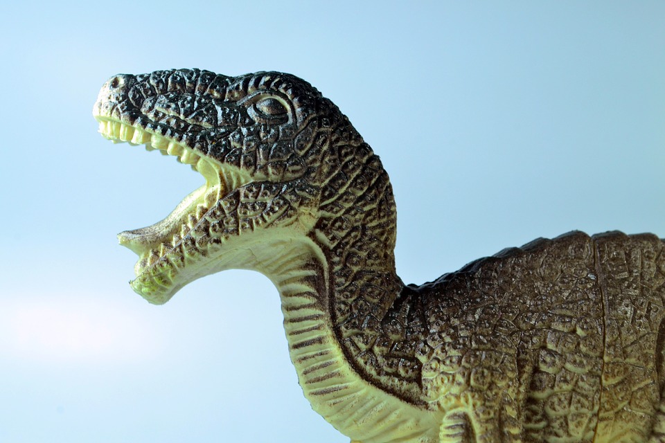 sketch of a dinosaur in front of blue sky