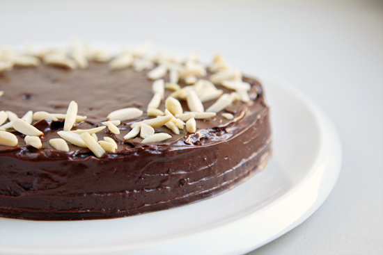 A gooey chocolate cake sprinkled with almonds.