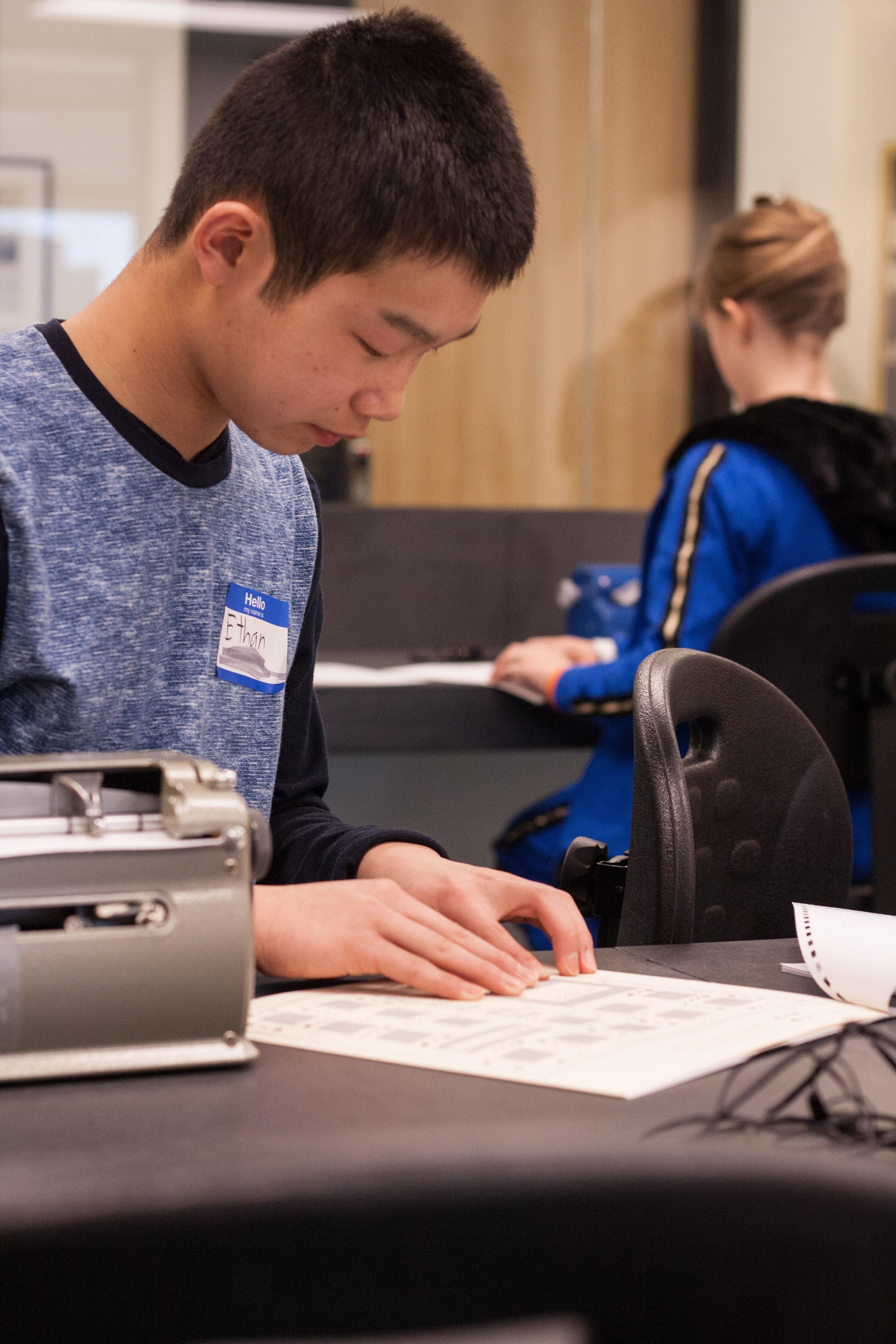 Junior Varsity competitor Ethan works on the graphs and charts portion of the test.