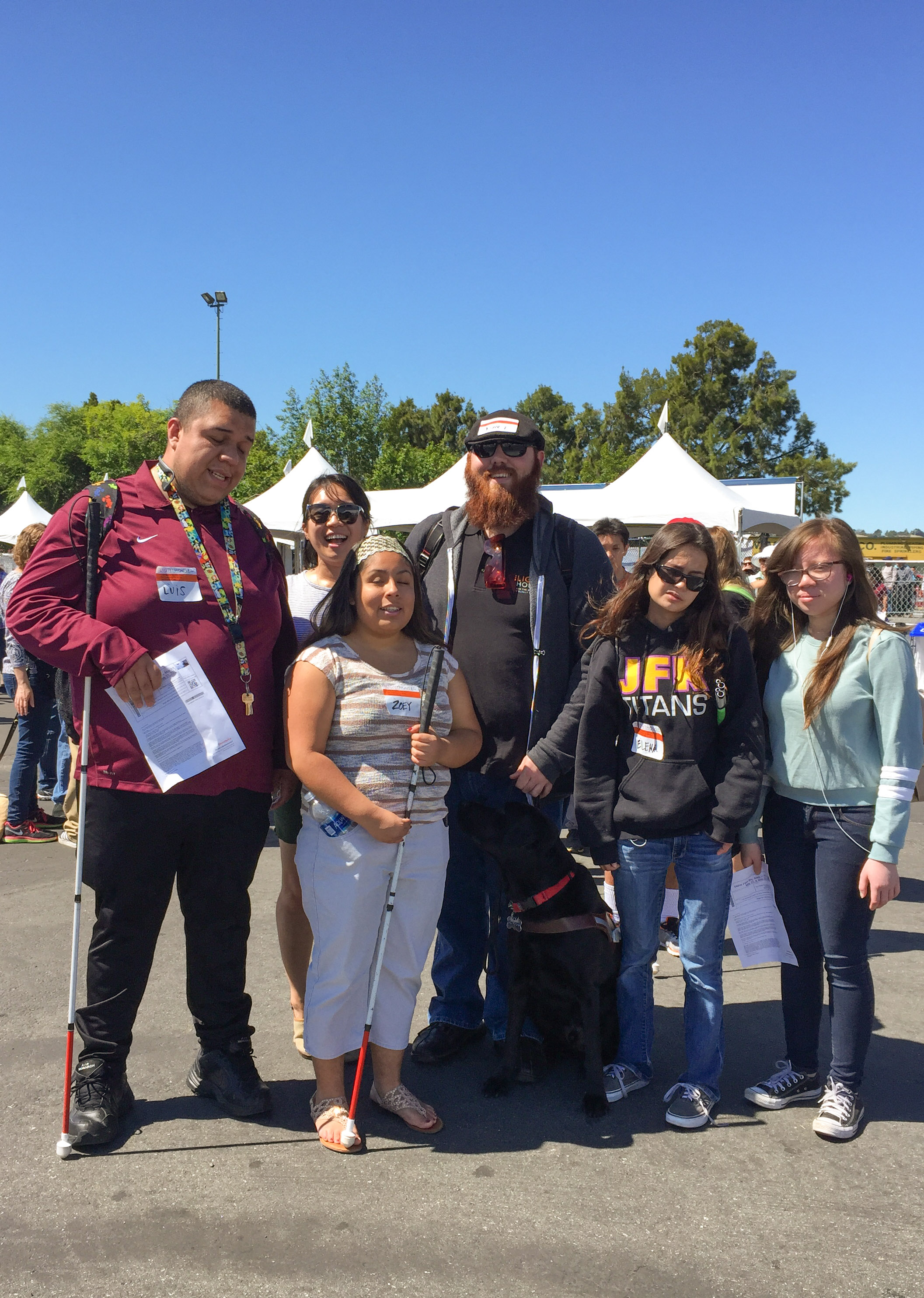 Jamey and five students smile for a group picture.