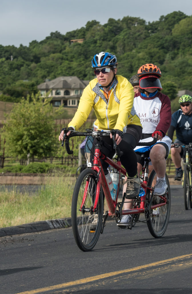 Kit and her fitness partner Nancy ride along a winding rode in Napa during Cycle for Sight.