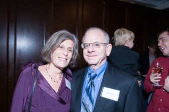 A pair of Gala attendees stand smiling.