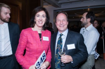 A pair of Gala attendees stand smiling.