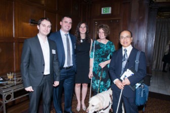 A group of five Gala attendees stand smiling.
