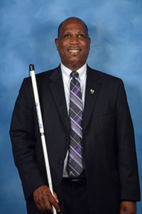A portrait of Anil Lewis.