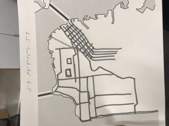 A tactile map of Burning Man, hand drawn on swell paper.