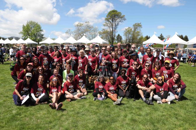 Members of Team Enchanted Hills pose and smile together after the race.