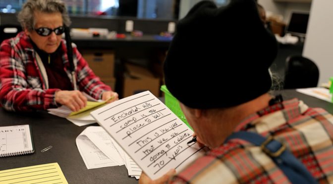 Enchanted Hills Camp employee Linda Fonseca uses large print note-taking tools to write about the 70th anniversary of EHC at a Hands On workshop. Photo by Sarika Dagar.