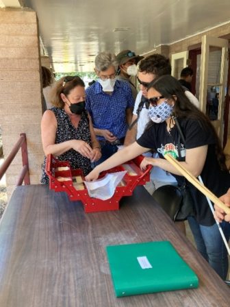 Campers touch replicas of Wappo Tribe artifacts