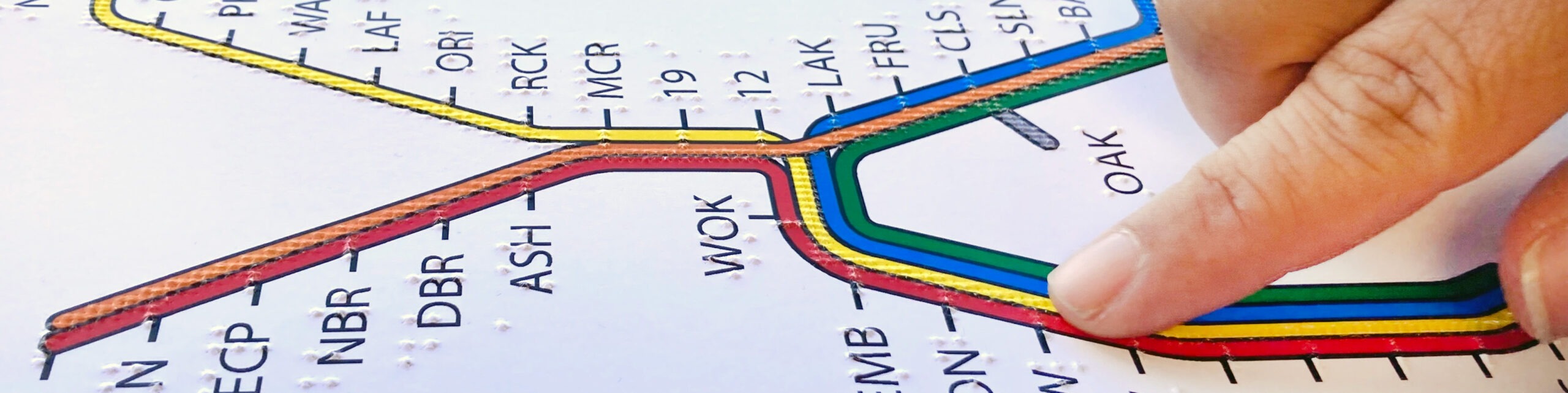Finger on tactile BART system map.
