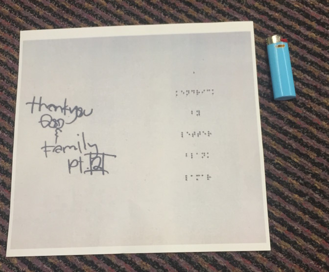 a page from Kendrick Lamar's CD booklet, blown up and Brailled
