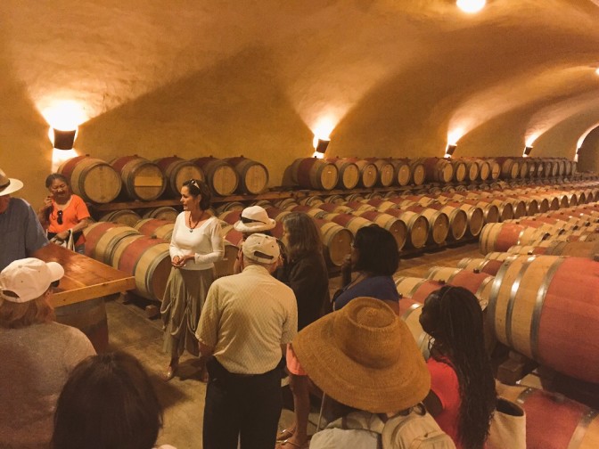 Valli Ferrel, one of the program's first students, leads a tour of Spring Mountain Winery where she directs PR