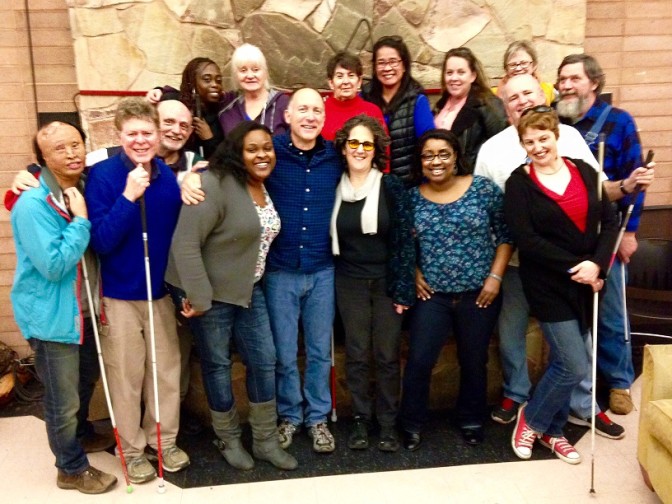 Students and instructors from the January class gather for a group photo in front of the fireplace at Enchanted Hills Retreat