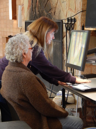 LightHouse Rehabilitation Counselor Debbie Bacon trains Immersion participant Judi Lewis on how to use a video magnifier (Photo Credit: Patti Rose)