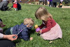 LightHouse Little Learner crawls to his sister on the lawn