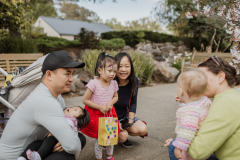Two families talking and enjoying the egg hunt together